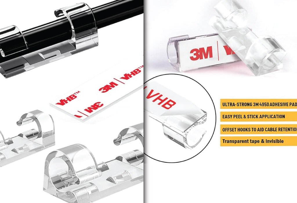 A close-up of a transparent finisher wire clamp holding a black cable. The image highlights its features, including ultra-strong 3M adhesive pads and offset hooks for cable retention, making it a key accessory for Finisher Wire Clamp for Graphic Design Agency Setup Accessories.
